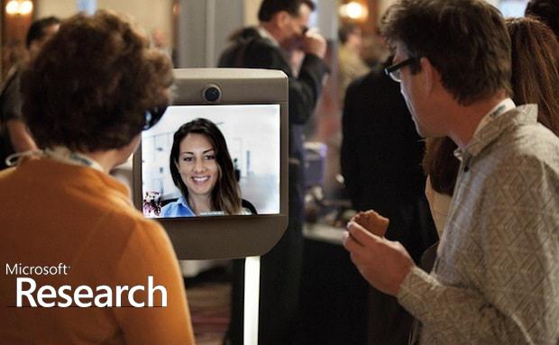 A telepresence robot in conversation at a Microsoft Research event