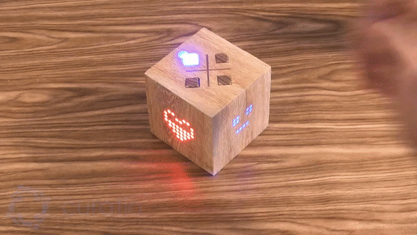 The Curatio object on a bedside table, lighting up as a message arrives